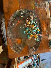 an artist's palette with paints on it