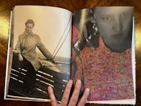 an open book with a photo of a woman on a boat