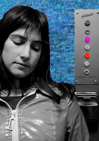 a woman with her eyes closed in an elevator