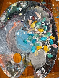 an artist's palette on a wooden table