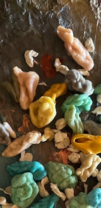 a pile of colorful plastic pieces on a table
