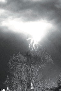 a black and white photo of a lightning strike