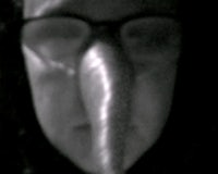 a black and white photo of a person with a long nose